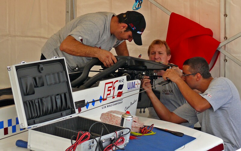 boatyard team quatar carefully lines up the motor sandwich